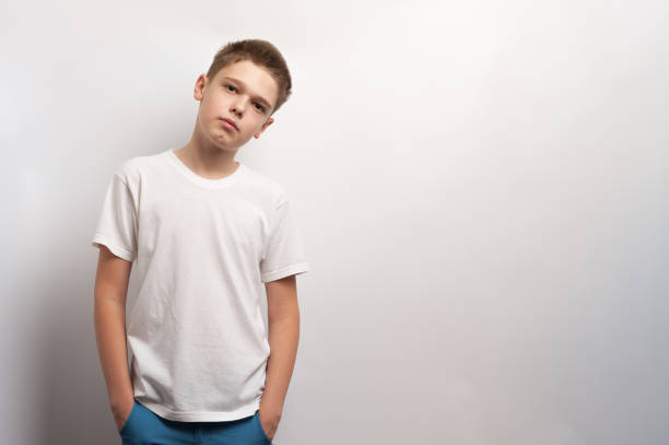 A boy model posing in a white t-shirt