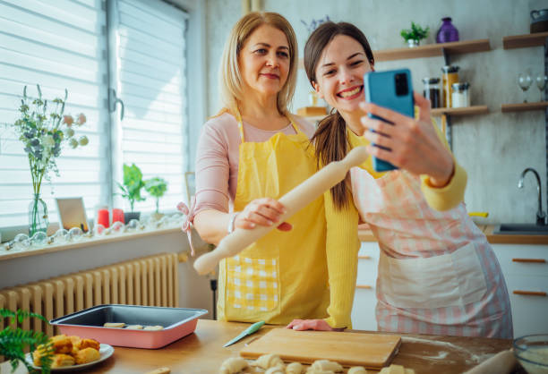 istock Mother and daughter taking a selfie in the kitchen 1465376908