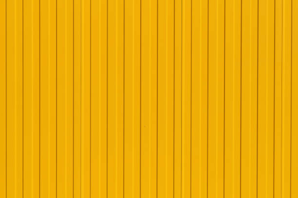 istock Bright yellow profiled metal wall, fence or warehouse idea, background for screen or design ideas 1465377404