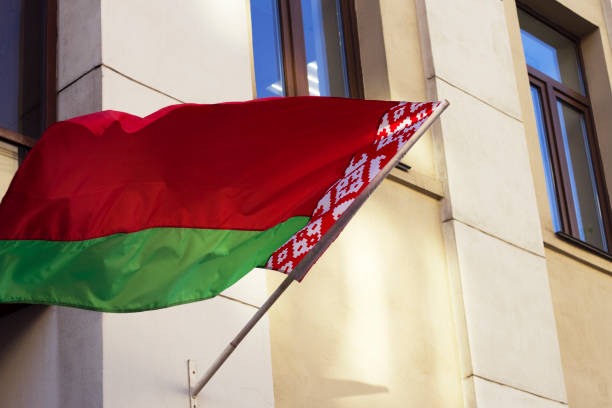 belarussian flag in the city - flag of belarus imagens e fotografias de stock