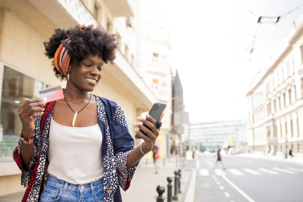 istock Cheerful  young woman doing online shopping 1465385023