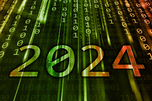 2024 text written on a green flowing binary code background. New Year 2024 celebration concept.