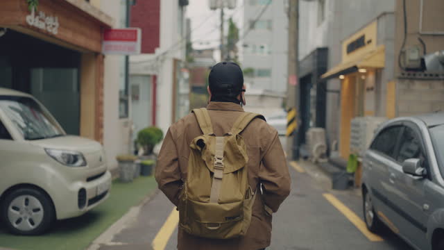 Asian man walking in the local city in South Korea.