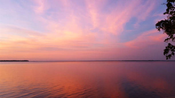 istock Colorful sunset/sunrise over water 1465407386