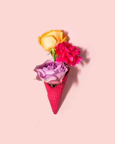 istock Pastel flowers in ice cream cone on light pink background. Creative food concept. Minimalistic nature composition. Sunny summer day idea. 8th march idea. 1465409380