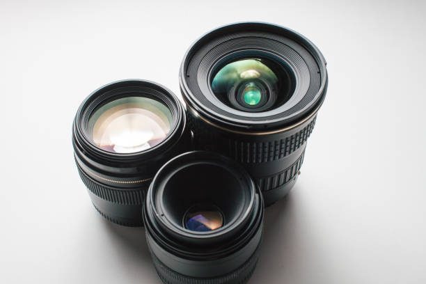 istock close-up view of a group of camera lenses on a white surface 1465410751