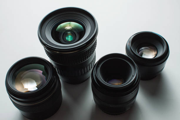 istock close-up view of a group of camera lenses on a white surface 1465410754