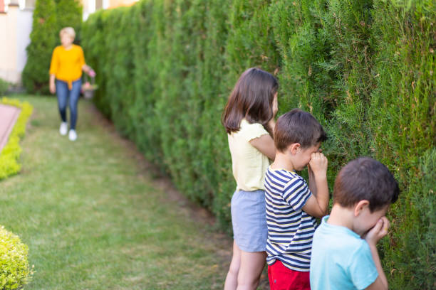 istock Children hiding their eyes and counting while mum hides the Easter Eggs 1465410993