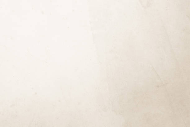 istock Colour old concrete wall texture background. Close Up retro plain cream color cement wall background texture. Design paper vintage parchment element show or advertise or promote product on display. 1465411794