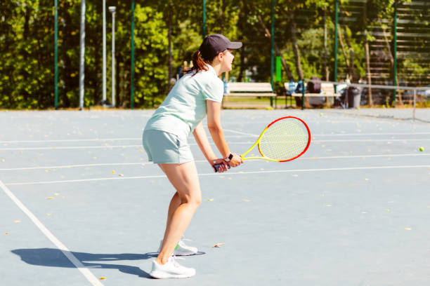 istock Woman playing tennis 1465412307