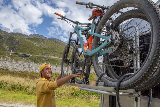 istock Man loading mountain bikes on the back of a van 1465414167