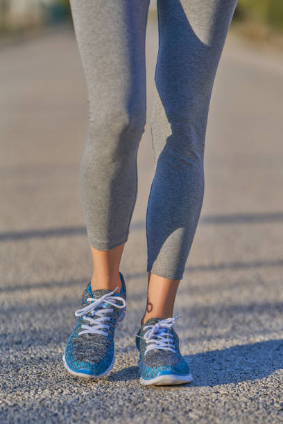 istock close up view of woman legs while walking 1465414302
