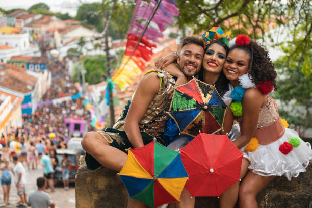 istock Friends hugging at Carnival in Brazil 1465417392