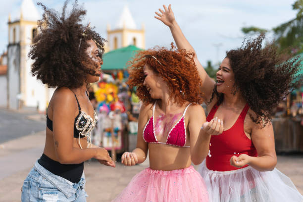 istock Women throwing confetti at Caranval do Brasil 1465418109