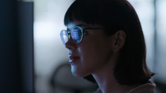 Night, computer and woman glasses reflection for software development, digital coding research or cybersecurity. Programmer, information technology or programming person reading html script in dark