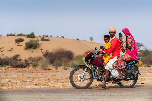 Indian family of 4 on a motorcycle, Rajasthan, India.