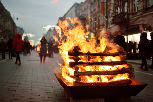 Bonfires are lit on Gediminas avenue on the night on February 16 in Vilnius, Lithuania. People attending the celebration of Restoration of the State Day.