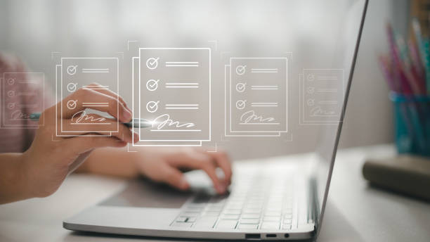 istock E-signing, electronic signature, document management, paperless office. Hand signing on e-document on a digital tablet, virtual notepad on virtual screen, Online contract signing with application 1465443883