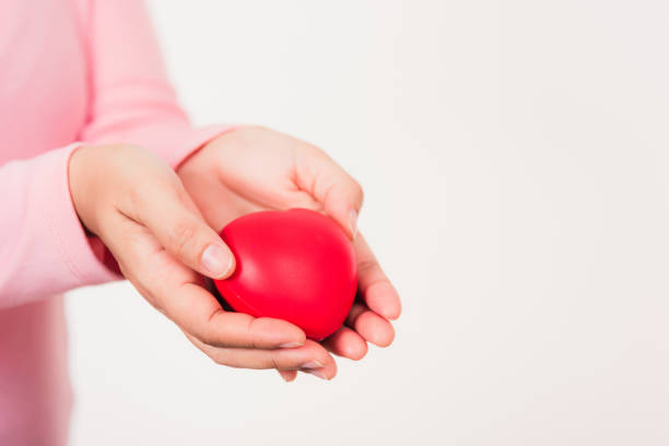 istock Female beauty hands holding modern a red heart 1465444069