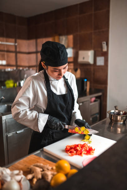 istock Asian Chef Preps Leek and Peppers for Dish 1465447118