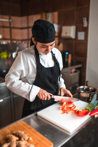 istock Good Looking Vietnamese Chef Prepping Vegetables 1465447132