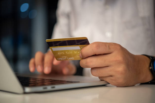 istock man hands holding credit card using internet payment laptop computer, online shopping digital banking, Business financial technology concept. 1465453322