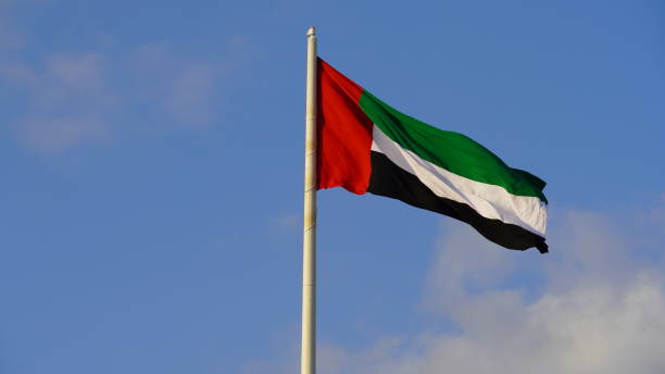 istock United Arab Emirates flag against blue sky 1465453668