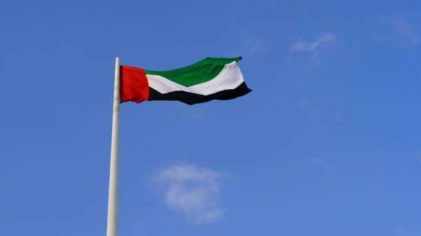 istock United Arab Emirates flag against blue sky 1465453695