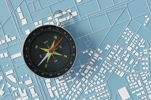 Top View with a compass on a city map, 3d rendering