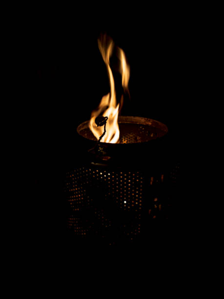 The fire dancing in a laundry drum fire pit. stock photo