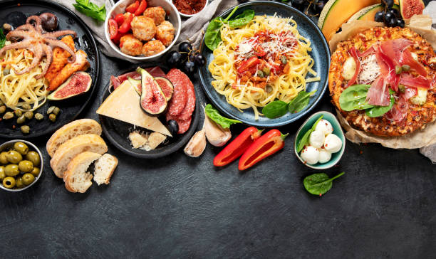 istock Dinner table of italian meals dishes. 1465456762