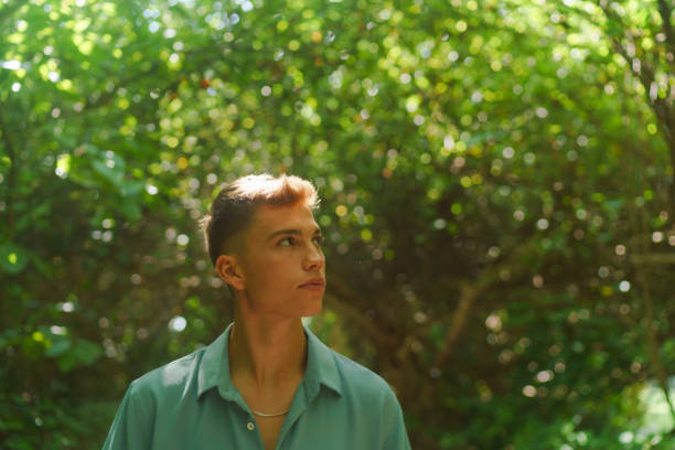 istock Portrait of young man in tropical forest 1465456901