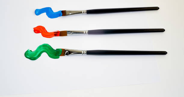 artists brushes with colored oil paint