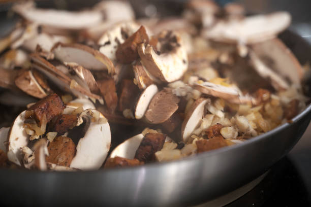 Cooking brown mushroom in a fry pan