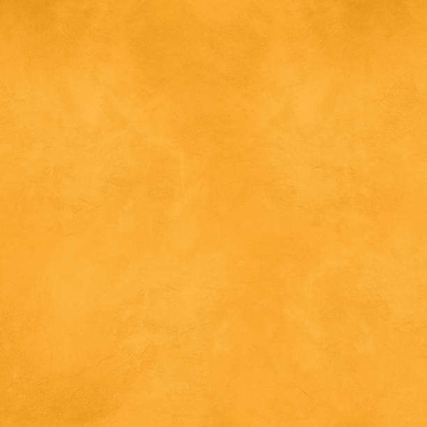 istock Empty yellow gold concrete wall background 1465463251
