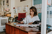 Small local business, Accounting working with financial bill