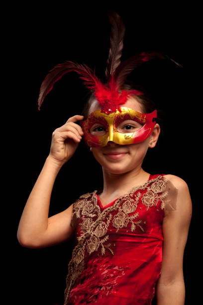 Party time, holidays, people and celebration concept. Woman long hair holds carnival mask close up