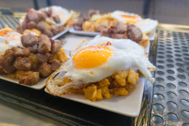 istock Scrambled potatoes with fried egg or patatas revolconas 1465469067