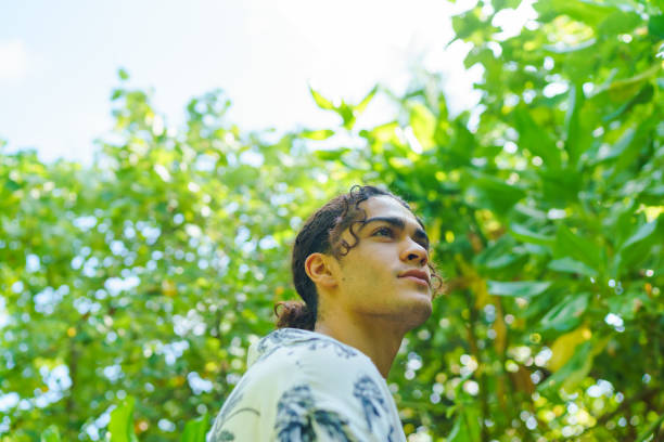 istock Portrait of young man in tropical forest 1465469152