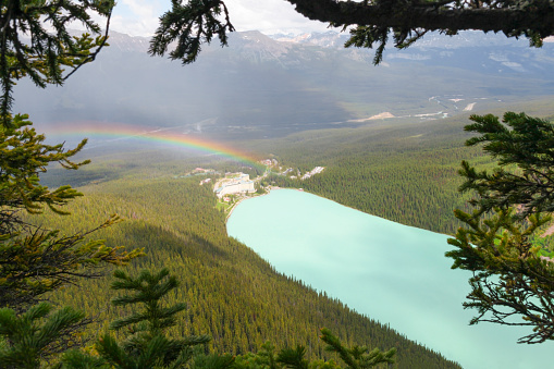 Beautiful Lake Louise with rainbow and Fairmont Chateau Lake Loiuse hotel in Banff National Park, Alberta, Canada.