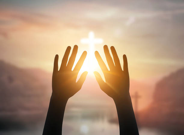 istock Religious concept:Christian  with open hands prayer on cross background 1465472402