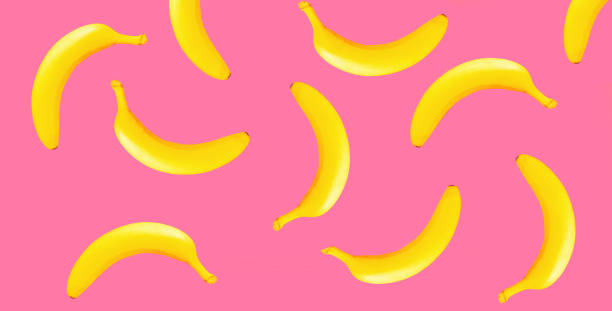 istock Stylish creative image yellow banana on pink background 1465476166