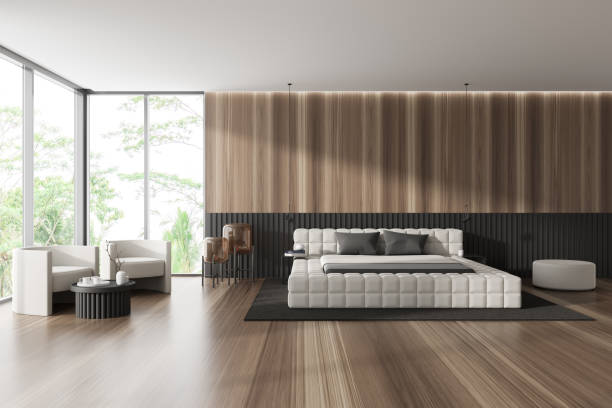 istock Stylish wooden bedroom interior with bed and armchairs, panoramic window 1465476338
