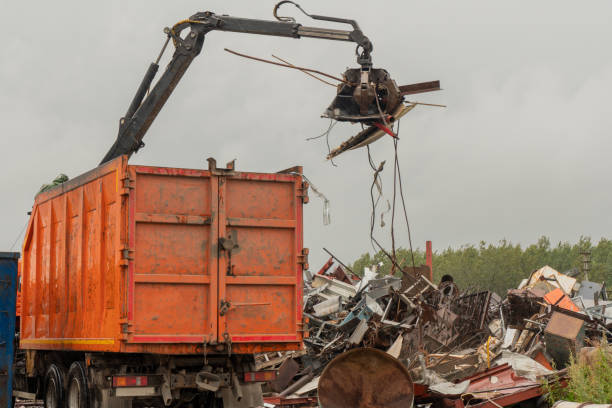 istock Loading of scrap metal by hydraulic crane, for recycling. 1465476929