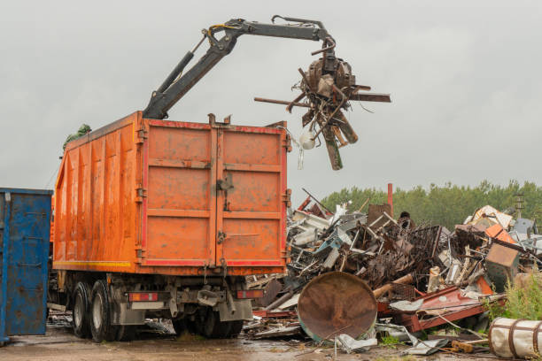 istock Loading of scrap metal by hydraulic crane, for recycling. 1465476930
