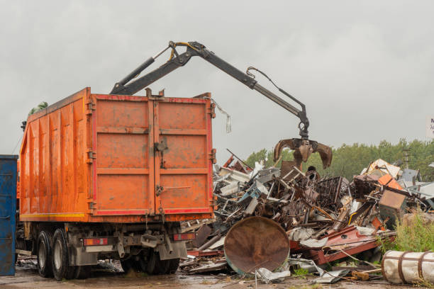 istock Loading of scrap metal by hydraulic crane, for recycling. 1465476932