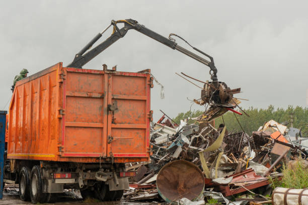 istock Loading of scrap metal by hydraulic crane, for recycling. 1465476948