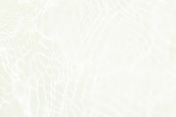 istock Defocus blurred transparent white colored clear calm water surface texture with splashes and bubbles. Trendy abstract nature background. Water waves in sunlight with copy space. White water shine 1465477758