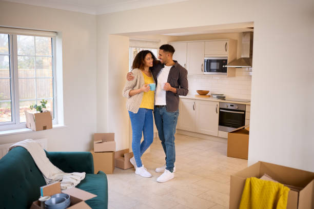 istock Excited Couple Unpacking Boxes Looking Around New Home On Moving Day 1465479243