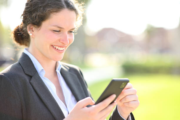 istock Businesswoman checking smart phone 1465481263